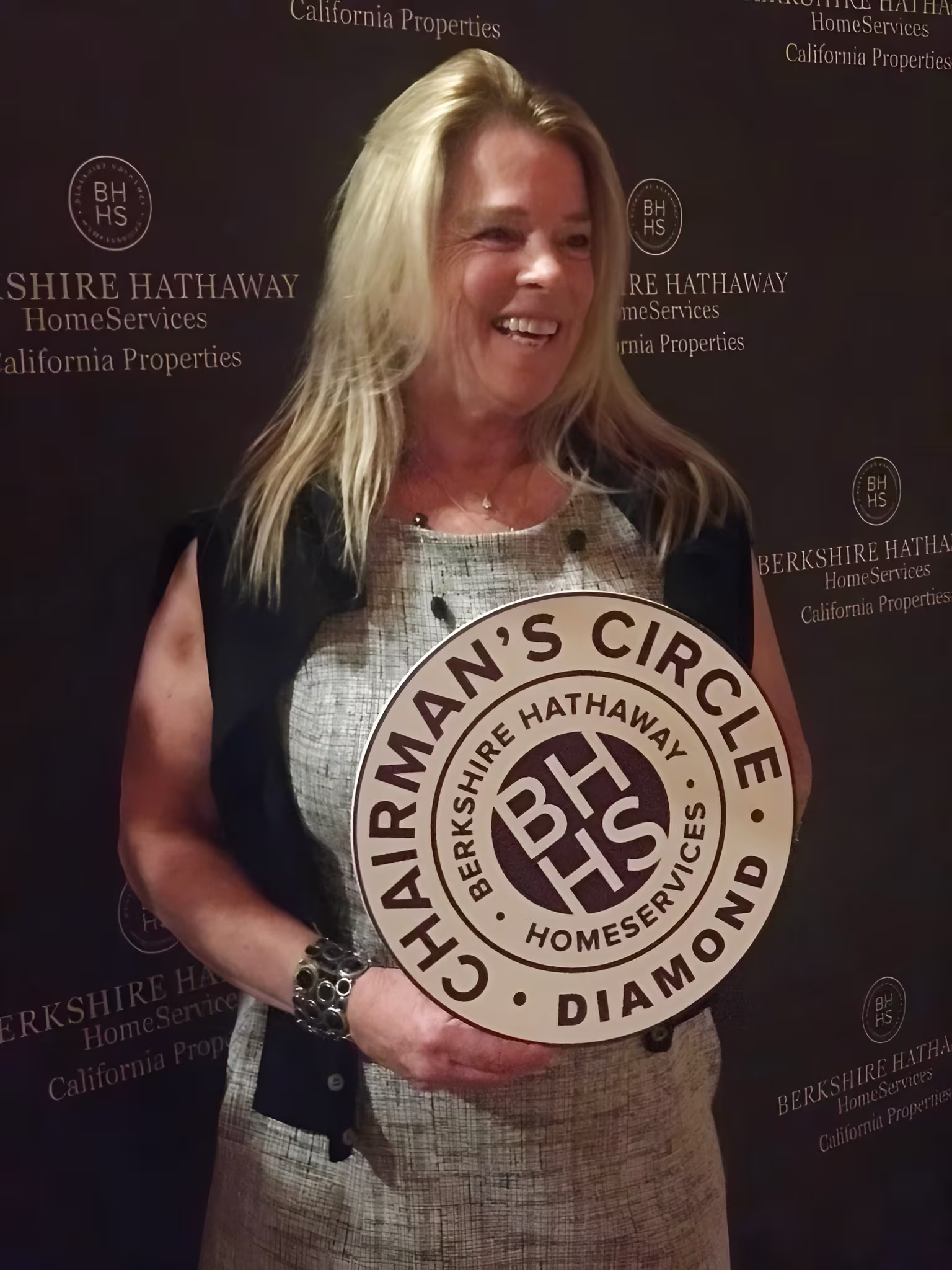 Karen Parcell holding her Chairman's Circle Diamond award